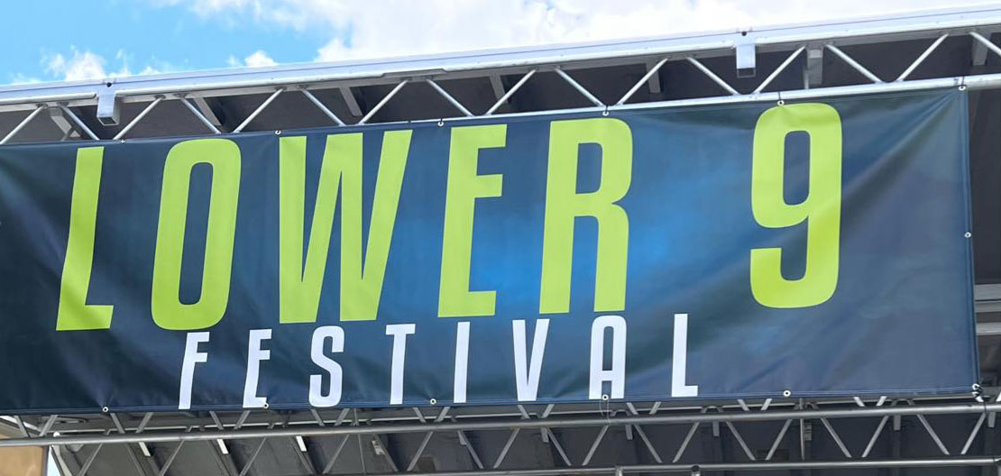 dark green banner with bright green and white text that reads: LOWER 9 FESTIVAL